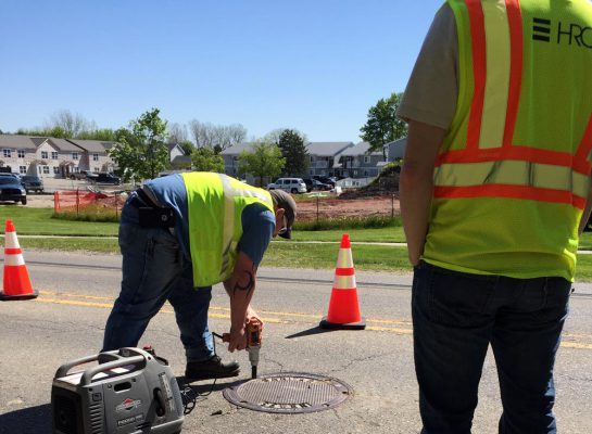 hrc crew on scene accessing a manhole